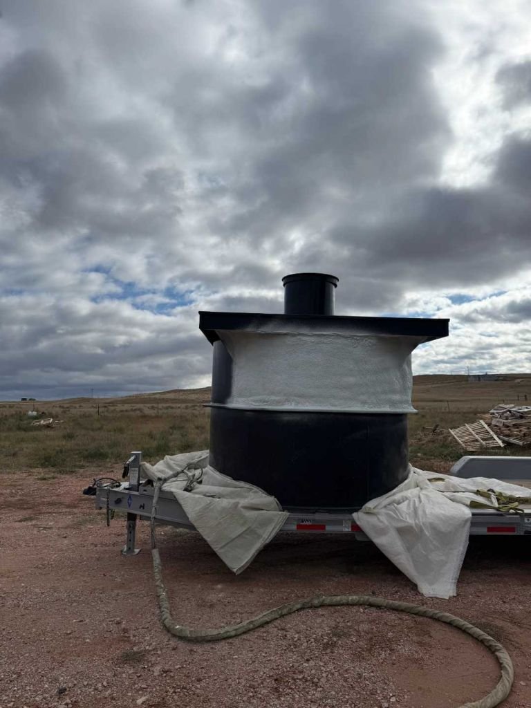 Foam-insulated cistern tank ready for placement, Pine Haven, Wyoming